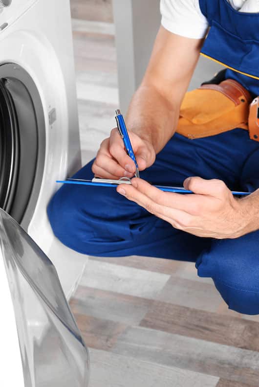 Plumber Checking Washing Machine - Alpine Refrigeration & Air Conditioning In West Wallsend,NSW